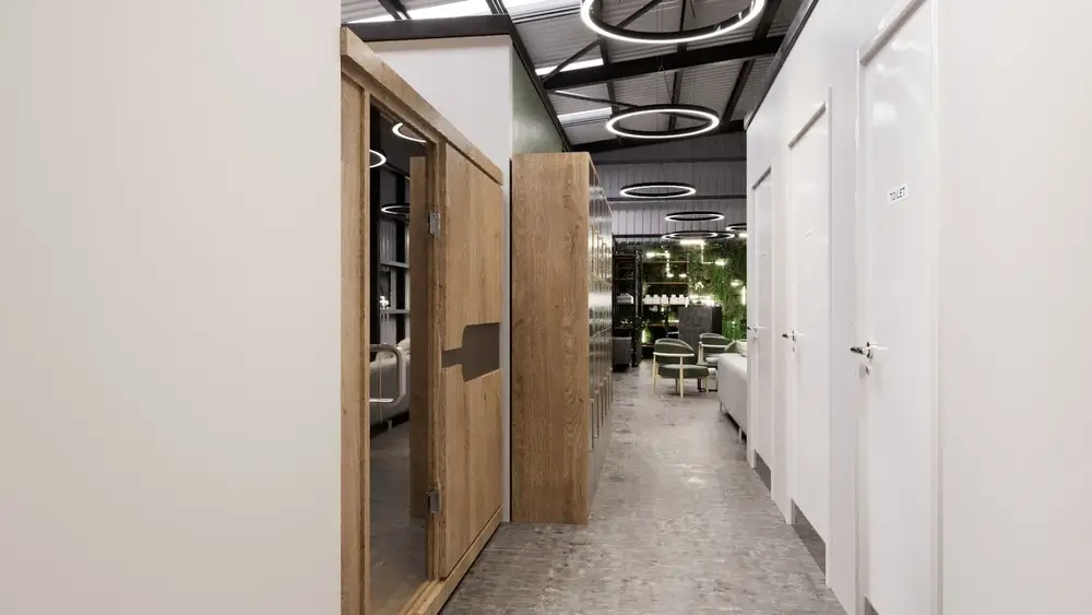 Neatly stored gray yoga blocks and yoga mats inside a modern Rephoria studio.